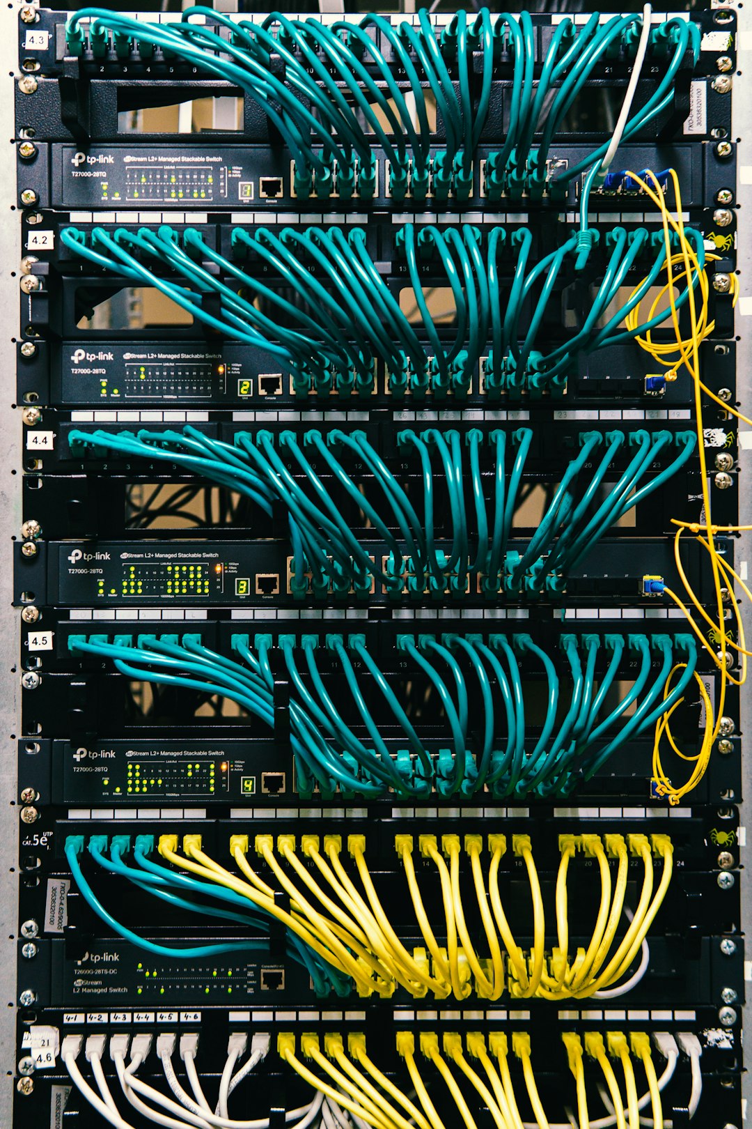 about-us-02 a-rack-of-servers-with-wires-and-wires-attached-to-them-c-lsqecd9oi